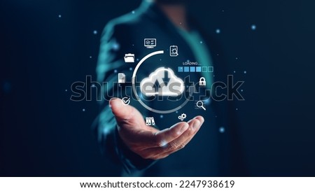 Businessman showing virtual glowing cloud computing to download and loading data information and upload on system network application. Technology data transformation concept, data transfer. Royalty-Free Stock Photo #2247938619