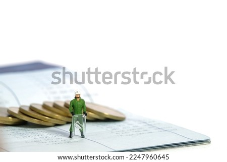 Miniature people toy figure photography. Bank account protection concept. A military anti riot armored army standing above bank account with coin. Isolated on white background. Image photo