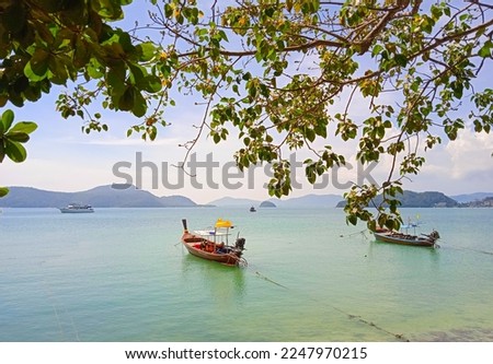 land scape picture of andaman sea with boat in the sunny day at cape panwa Phuket Thailand.