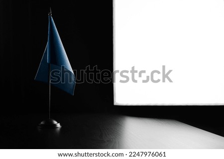 Small national flag of the Semeral Postal Union on a black background.