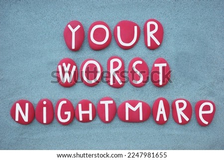 Yopur worst nightmare, creative text composed with red colored stone letters over green sand