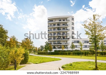 Cityscape of a residential area with modern apartment buildings, new green urban landscape in the city Royalty-Free Stock Photo #2247988989