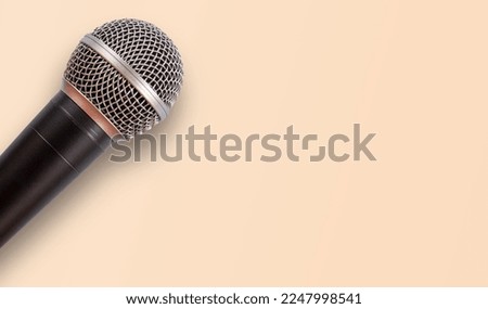 directional microphone isolated on colored background with copy space