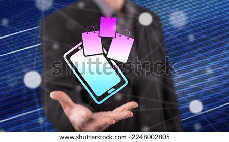 Online shopping concept above the hand of a man in background