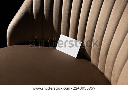 Blank business cards mockup template on a velvet, beige art deco furniture, real photo. Isolated surface to place your design.  Royalty-Free Stock Photo #2248035959