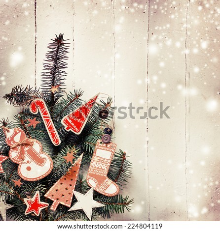 Christmas design - Merry Christmas. Xmas wreath card with copyspace on wooden background. Christmas background with handmaid christmas decorations