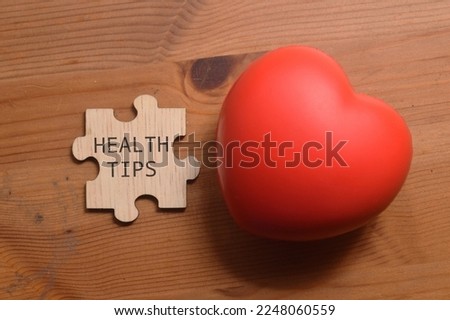 Health Tips wording on pieces of puzzle. Medical concept 
