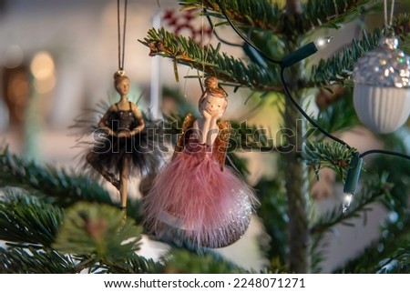 Christmas tree decorations.
Christmas tree dress like two ballerinas. Photo focus on ballerina in pink dress. A good gift for a little ballerina.