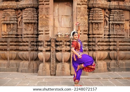 Beautiful girl dancer in the posture of Indian dance. Indian classical dance Odissi. Incredible india. Hand gesture Royalty-Free Stock Photo #2248072157