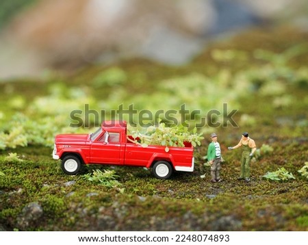 Toy photography concept at outdoor. Background is blurred.