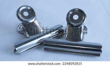 Gray metal clip for crafts. Royalty-Free Stock Photo #2248092815