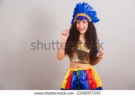young teen girl, brazilian, with frevo clothes, carnival. dancing.