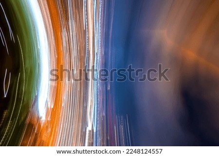 Abstract blurred bokeh neon light trails city night background
