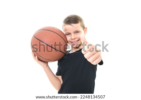 A boy playing basketball isolated on white background