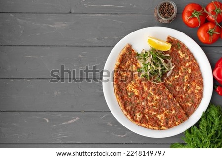 Baked homemade flatbread on wooden background close up