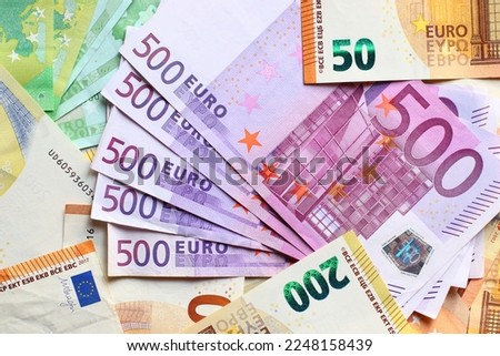 Euro currency banknotes background. European paper money backdrop with 100, 200 and 500 euros bills. Royalty-Free Stock Photo #2248158439