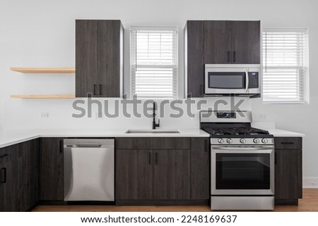 Style Home Still Lifestyle Image. Contemporary Kitchen Design with Dark Wood Cabinets and Open Shelving. Empty Counters for Virtual Staging. Social Media Banner. Royalty-Free Stock Photo #2248169637