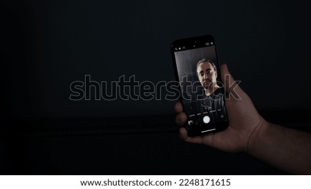 man taking selfie. Man taking selfie on black background Royalty-Free Stock Photo #2248171615