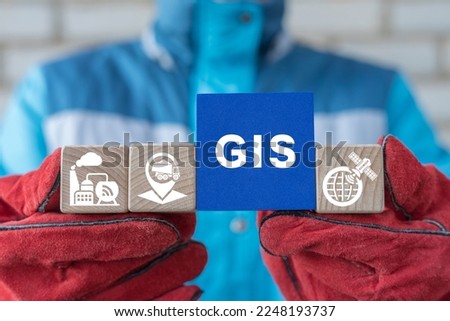 Engineer holding blocks with conceptual banner: GIS. Concept of GIS Geographic Information System Modern Industry Transportation Technology. Royalty-Free Stock Photo #2248193737