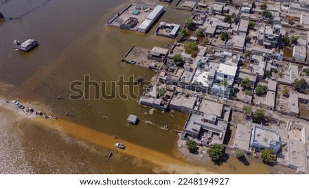 Flood in Pakistan, village houses effected by flood and underwater in Sindh Pakistan. Royalty-Free Stock Photo #2248194927