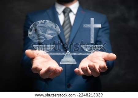 Choice between religion and rationality. On the scales of the cross and brains from the network. Man holding in his hand Royalty-Free Stock Photo #2248213339