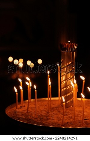 soft selective focus, church candles in temple, faith and religion for Christians and Catholics. light in dark for prayer and meditation, spiritual development and improvement.