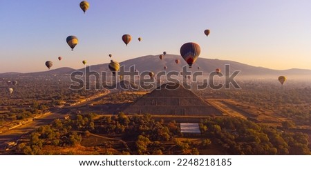 Sunrise on hot air balloon over the Teotihuacan pyramid Royalty-Free Stock Photo #2248218185