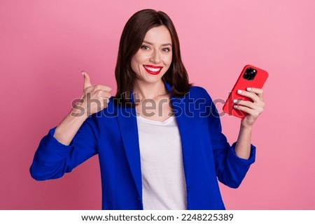 Photo of glamour successful lady wear blue stylish suit arm thumb up cool offer quality modern device isolated on pink color background