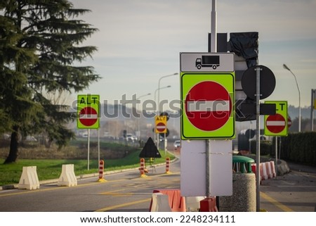 Many Wrong or one way signs on italian motorway with writing alt or stop. High visibility color of one way road on motorway.