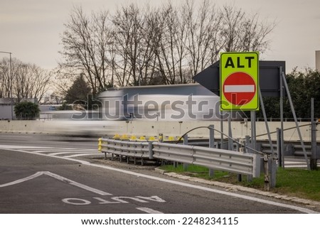 Wrong or one way sign on italian motorway with writing alt or stop. High visibility color of one way road on motorway.