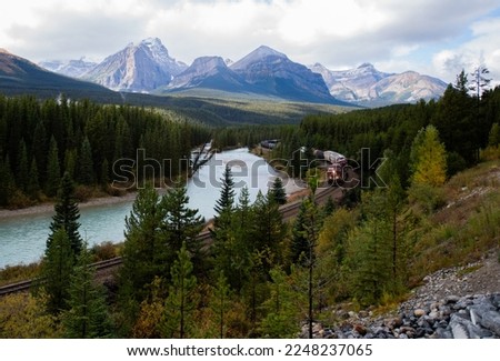 Canadian train rounding the corner at Morant's Curve in fall