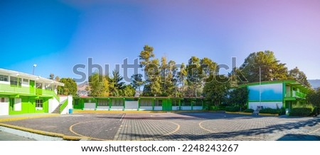 Panoramic view of the main courtyard of a high school without students on a quiet morning Royalty-Free Stock Photo #2248243267