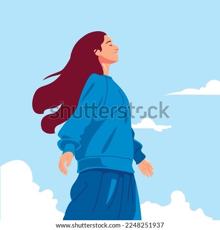 A woman is enjoying the fresh air 