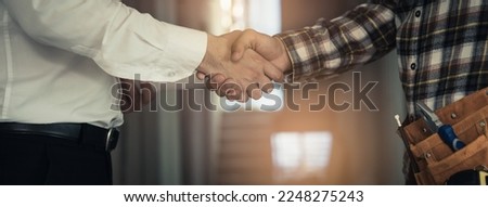 construction worker and contractor. Client shaking hands with team builder in renovation site. Royalty-Free Stock Photo #2248275243
