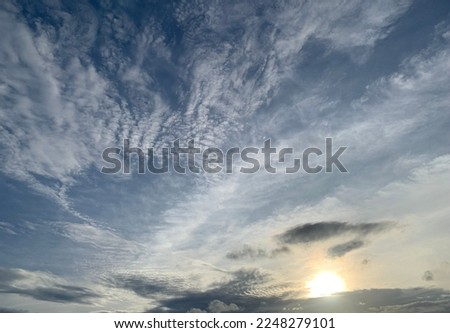 Altocumulus clouds are full of streaks of beautiful usually appear between lower stratus clouds and higher cirrus clouds imagination is like an eagle spreading its wings across at Thailand.no focus Royalty-Free Stock Photo #2248279101