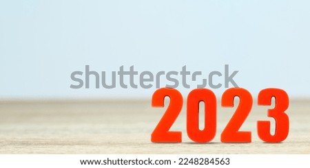 Shot of a number 2022 made of red plastic new year on table with copy space