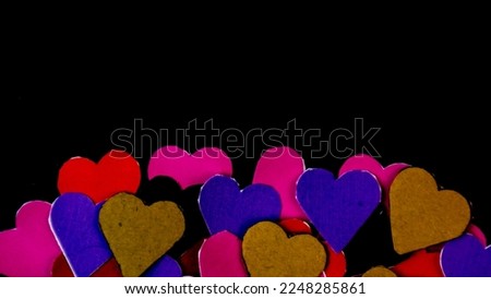 colorful hearts on black background for valentine's day
