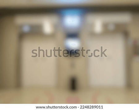 unfocused abstract background of two elevators in the shopping mall