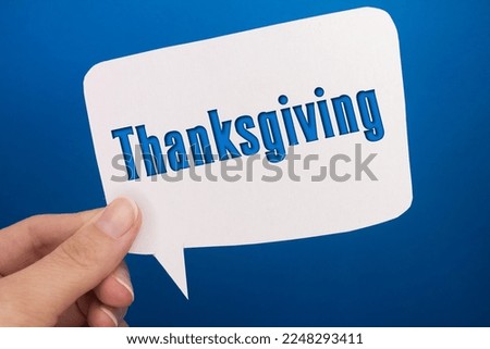 Speech bubble in front of colored background with Thanksgiving text.