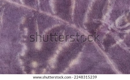 Texture background of natural white leaf from eco print process. Colorful Eco-printing on violet fabric background. 