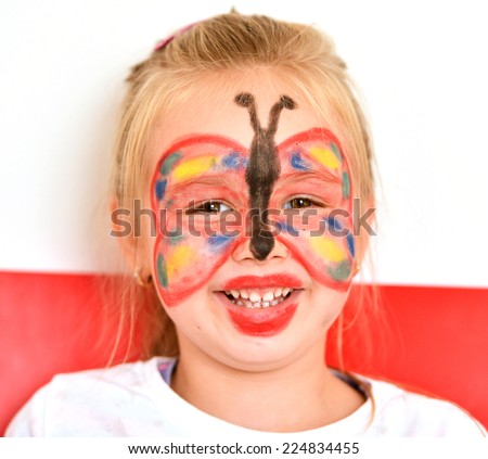 Little girl with painting face as a butterfly