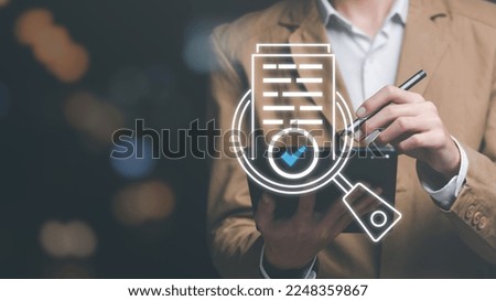 Businessman Audit documents, quality assessment management With a checklist, business document evaluation process, market data report analysis and consulting, plan review process Royalty-Free Stock Photo #2248359867
