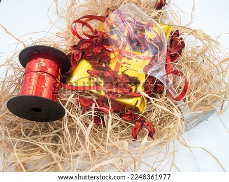 Valentine's Day or birthday concept, copy space area,yellow gift box, dried red rose leaf