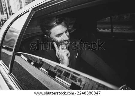 Business man in his limousine Royalty-Free Stock Photo #2248380847