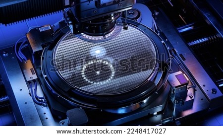 Silicon Wafer during Photolithography Process inside Complex Computer Chip Production Machine. Semiconductor Manufacturing at Modern Fab or Foundry. Royalty-Free Stock Photo #2248417027