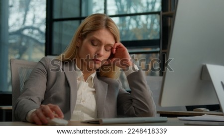 Tired lazy adult middle-aged woman female manager employee worker bored at work project online in computer in office Caucasian mature ill businesswoman need energy asleep feel overworked exhaustion Royalty-Free Stock Photo #2248418339