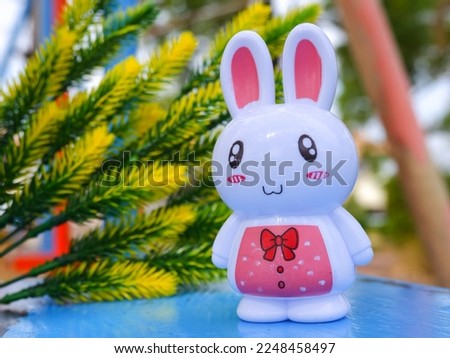 little white rabbit in pink dress
