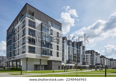 New modern block of flats in green area. residential apartment with flat buildings exterior. luxury house complex. Part of City Real estate property, condo architecture. apartment insurance concept. Royalty-Free Stock Photo #2248466965