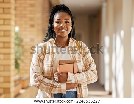 Face, student portrait and black woman in university ready for learning, goals or targets. Education, scholarship and happy female learner from South Africa with books for studying and knowledge. Royalty-Free Stock Photo #2248535229