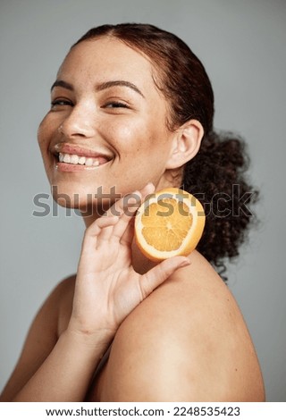 Woman, studio portrait and orange for skincare, health and wellness with cosmetic glow, self care and backdrop. Model, black woman and fruit for cosmetics, diet and healthy natural skin by background